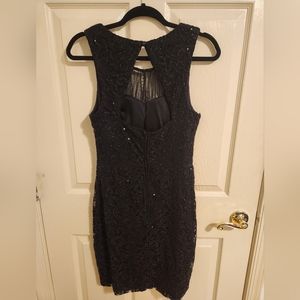 Black sequined and lace cocktail dress. Size 13 but fits like a 10 woman